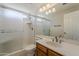 This bathroom offers functionality with a shower, toilet, and vanity with a mirror, all within a compact space at 625 E Silver Creek Rd, Gilbert, AZ 85296