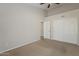 Large bedroom featuring carpet flooring, high ceilings and a closet for storage solutions at 625 E Silver Creek Rd, Gilbert, AZ 85296