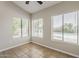 Bedroom with tile flooring and natural light from large windows overlooking the pool area at 625 E Silver Creek Rd, Gilbert, AZ 85296