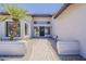 Close up of the front entrance showing brick walkway and a desert landscape at 625 E Silver Creek Rd, Gilbert, AZ 85296
