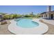 Backyard with a large pool, lush landscaping, and a privacy fence at 625 E Silver Creek Rd, Gilbert, AZ 85296