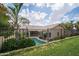 Private backyard oasis with sparkling pool, lush landscaping, and secure fencing at 6388 W Donald Dr, Glendale, AZ 85310