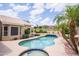 Gorgeous pool surrounded by mature trees provides a perfect outdoor retreat for relaxation and entertainment at 6388 W Donald Dr, Glendale, AZ 85310