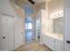 Bathroom with built in closet shelves at 6388 W Donald Dr, Glendale, AZ 85310