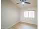 Bright and airy bedroom featuring wood-look flooring, neutral colored walls and a window at 6388 W Donald Dr, Glendale, AZ 85310