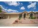 Attractive home with a spacious three-car garage and landscaped front yard at 6388 W Donald Dr, Glendale, AZ 85310