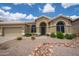 Charming single-story home featuring a neutral color palette and low-maintenance desert landscaping at 6388 W Donald Dr, Glendale, AZ 85310