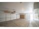 Clean, bright garage with overhead storage and durable flooring, perfect for organization at 6388 W Donald Dr, Glendale, AZ 85310