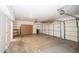 Spacious garage featuring ample storage cabinets and an automatic door opener at 6388 W Donald Dr, Glendale, AZ 85310