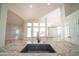 Spacious kitchen featuring an island with a sink, granite countertops, and an open layout at 6388 W Donald Dr, Glendale, AZ 85310