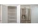 Pantry and stainless steel fridge in kitchen featuring ample storage at 6388 W Donald Dr, Glendale, AZ 85310