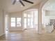 Bright and open living room offering abundant natural light and views of the kitchen and dining area at 6388 W Donald Dr, Glendale, AZ 85310