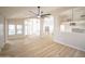 Open-concept living room with views of the kitchen, dining area, and lots of natural light at 6388 W Donald Dr, Glendale, AZ 85310