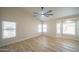 Bright main bedroom featuring many windows for natural light and a ceiling fan at 6388 W Donald Dr, Glendale, AZ 85310