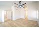 Spacious main bedroom featuring an open doorway to an en-suite bathroom at 6388 W Donald Dr, Glendale, AZ 85310