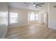 Light-filled main bedroom with ample windows and an open doorway to the attached bathroom at 6388 W Donald Dr, Glendale, AZ 85310