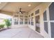 Covered patio with ceiling fan, neutral flooring and plenty of windows provides seamless indoor/outdoor living at 6388 W Donald Dr, Glendale, AZ 85310
