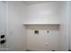 Utility room with open floating shelf at 6388 W Donald Dr, Glendale, AZ 85310