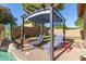 Beautiful backyard with lounge chairs, outdoor kitchen, and a lush lawn perfect for entertaining at 712 W Jade Dr, Chandler, AZ 85248