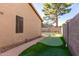 The backyard features a custom putting green, perfect for golf enthusiasts and outdoor entertainment at 712 W Jade Dr, Chandler, AZ 85248