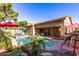 Backyard features a pool, covered patio and lush landscaping at 712 W Jade Dr, Chandler, AZ 85248