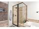 A tiled bathroom featuring a glass shower and a soaking tub at 712 W Jade Dr, Chandler, AZ 85248