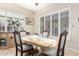 Dining room featuring plantation shutters allowing an abundance of natural light with furniture at 712 W Jade Dr, Chandler, AZ 85248