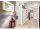 Inviting entryway with neutral walls, decorative artwork and travertine floors leading to the rest of the home at 712 W Jade Dr, Chandler, AZ 85248