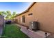 The house exterior features a well-maintained lawn and a modern air conditioning unit, ensuring year-round comfort at 712 W Jade Dr, Chandler, AZ 85248