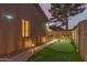 Exterior view of home with pathway, putting green and landscape lighting at 712 W Jade Dr, Chandler, AZ 85248