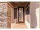 Inviting front entrance featuring a decorative door, stone accent wall, and tile flooring at 712 W Jade Dr, Chandler, AZ 85248