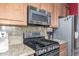 A kitchen featuring granite countertops and stainless steel appliances at 712 W Jade Dr, Chandler, AZ 85248