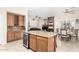 Open-concept kitchen with island seating connects to the living and dining areas, promoting easy entertaining at 712 W Jade Dr, Chandler, AZ 85248