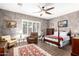 A bedroom featuring a four-poster bed, neutral paint, and a ceiling fan at 712 W Jade Dr, Chandler, AZ 85248