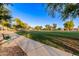 View of park offering scenic views of the walking trail lined with mature trees at 712 W Jade Dr, Chandler, AZ 85248