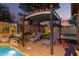 Outdoor patio featuring lounge seating, putting green and basketball hoop at 712 W Jade Dr, Chandler, AZ 85248