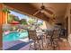 Covered patio with fans, outdoor seating, and views of the pool at 712 W Jade Dr, Chandler, AZ 85248