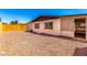 Backyard with gravel, bordered by fence, offers a private outdoor area for relaxation and activities at 7442 E Baseline Rd, Mesa, AZ 85209