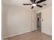 Bright and airy bedroom showcasing the wood-look floors, and attached bathroom at 7442 E Baseline Rd, Mesa, AZ 85209