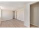A well-lit room boasts modern vinyl floors and neutral walls, providing a versatile and inviting space at 7442 E Baseline Rd, Mesa, AZ 85209