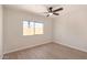 Bedroom featuring wood-look floors, large window, and a neutral color palette at 7442 E Baseline Rd, Mesa, AZ 85209
