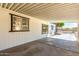 Covered carport features neutral colors, a window and plenty of natural light at 7442 E Baseline Rd, Mesa, AZ 85209