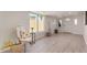 Bright living room featuring luxury vinyl plank flooring, a window and white paint at 7442 E Baseline Rd, Mesa, AZ 85209