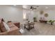Spacious living room with luxury vinyl plank flooring, comfortable seating, and neutral decor at 7442 E Baseline Rd, Mesa, AZ 85209