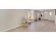 Bright living room featuring luxury vinyl plank flooring, a window and white paint at 7442 E Baseline Rd, Mesa, AZ 85209
