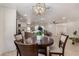 Open-concept living space featuring a dining area, living room, and modern kitchen for seamless entertaining at 7442 E Baseline Rd, Mesa, AZ 85209