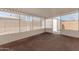 Spacious enclosed patio with white trim, providing a versatile outdoor living area great for entertaining at 7442 E Baseline Rd, Mesa, AZ 85209
