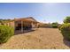 Backyard featuring low maintenance landscaping, a covered patio, and block wall fencing at 8952 W Monte Vista Rd, Phoenix, AZ 85037