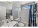 Bright bathroom featuring a tub with a shower, a vanity with sink and a decorative shower curtain at 8952 W Monte Vista Rd, Phoenix, AZ 85037