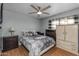 Functional bedroom with laminate floors and traditional furnishings at 8952 W Monte Vista Rd, Phoenix, AZ 85037